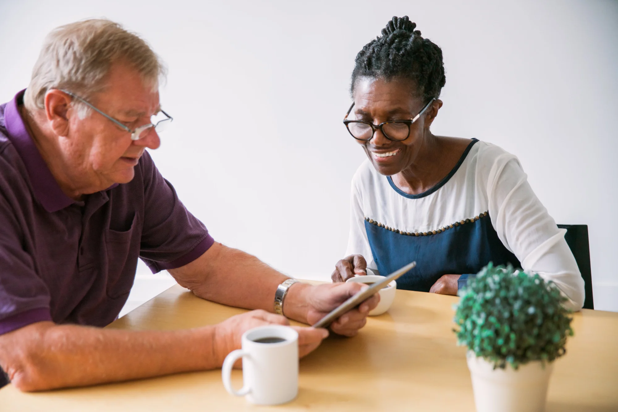 Dementia care for Black and Ethnic Minorities in the UK - photo of a woman and a man looking at a laptop